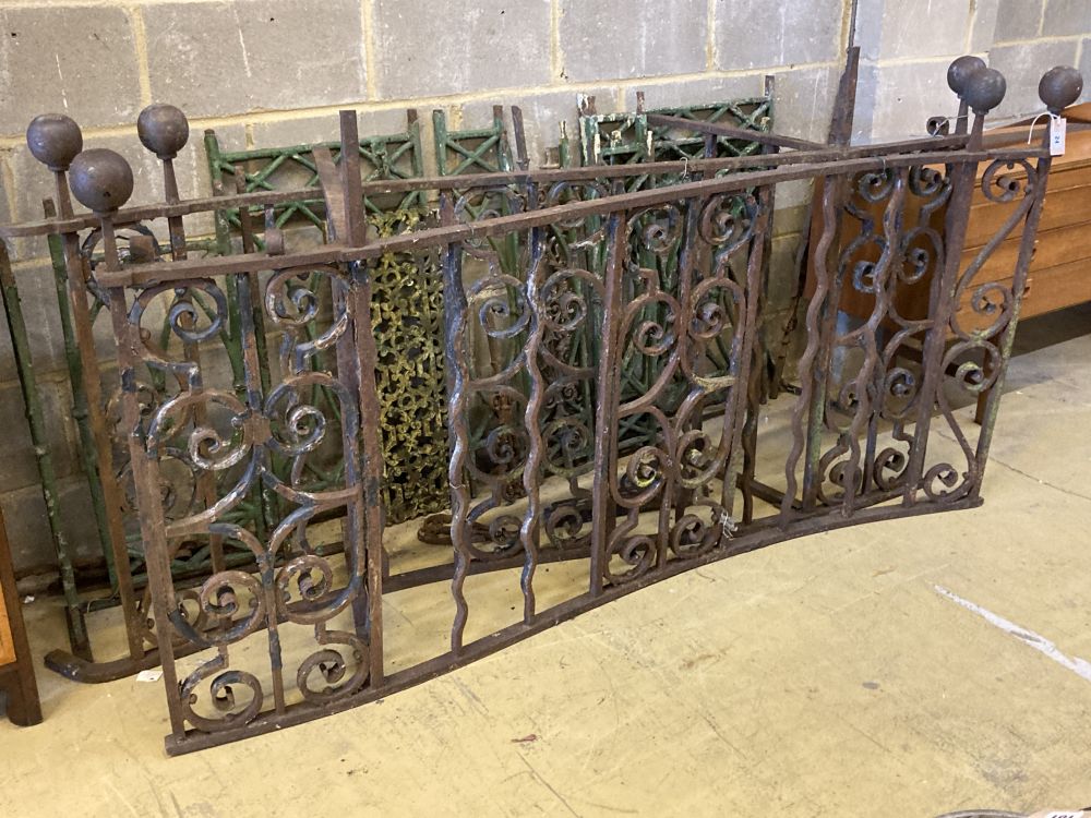 A cast and wrought iron two section balcony railings, total length approx. 385cm and assorted iron railings and panels